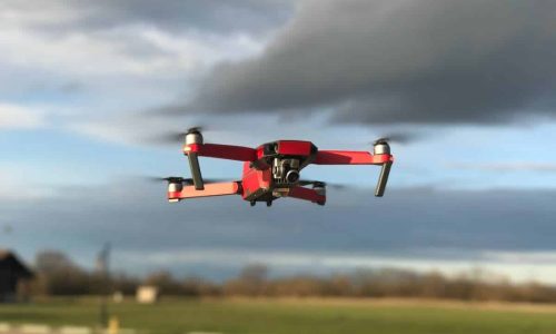 Red and White Drone Flying